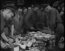 British Soldiers Receiving Food and Drinks at Camp, 1940. Creator: British Pathe Ltd