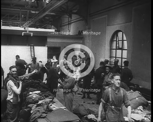 British Soldiers Receiving New Uniforms Back at Camp, 1940. Creator: British Pathe Ltd.