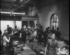 British Soldiers Receiving New Uniforms Back at Camp, 1940. Creator: British Pathe Ltd