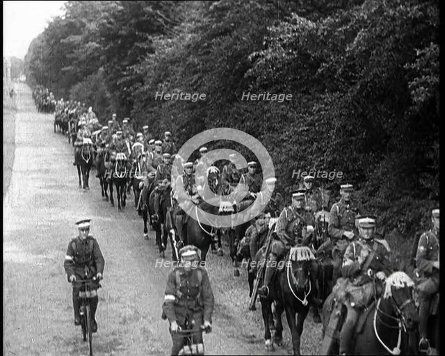 British Soldiers Riding Horses and Bikes on Salisbury Plain, 1933. Creator: British Pathe Ltd.