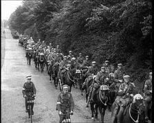 British Soldiers Riding Horses and Bikes on Salisbury Plain, 1933. Creator: British Pathe Ltd