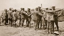 British soldiers searching captured German prisoners, Somme campaign, France, World War I, 1916. Creator: Unknown