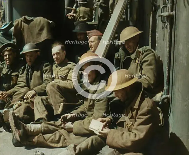 British Soldiers Sitting Aboard a Ship Taking Them Across the Channel Following the..., 1940. Creator: British Pathe Ltd.