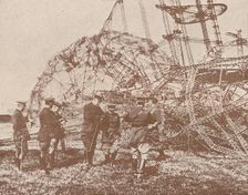 British staff officers examining the wreckage of a Zeppelin brought down in England, c1917 (1919)