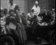 British Students in Fancy Dress Costumes Playing About at a Rag Event, 1920. Creator: British Pathe Ltd