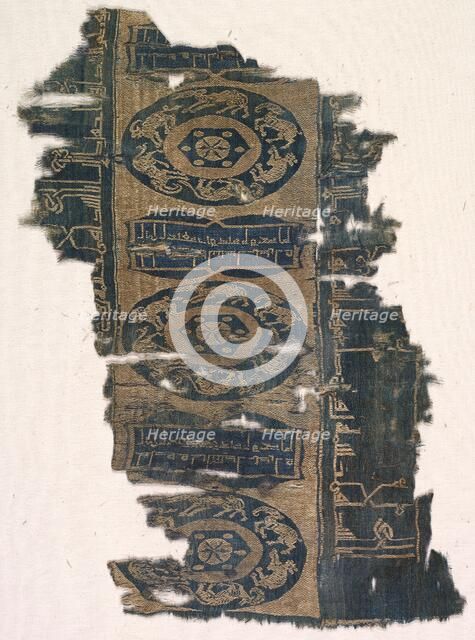 Brocaded silk fragment with running animal roundels and kufic inscriptions, 1530-1950. Creator: Unknown.