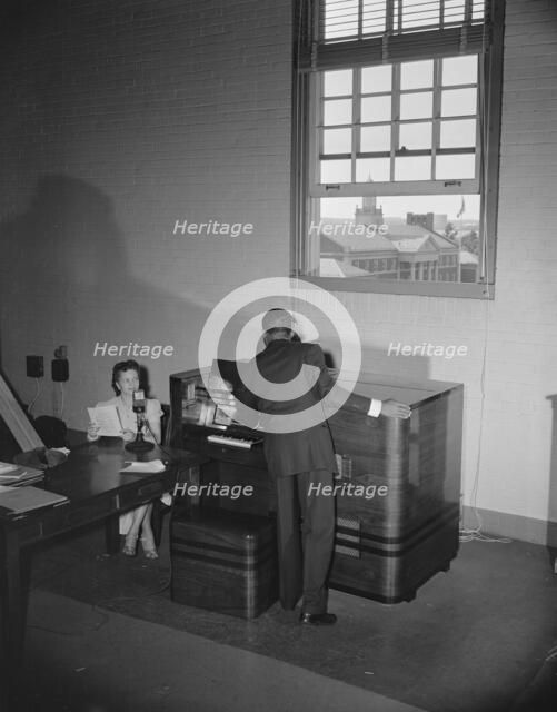 Broadcast tower at Howard University during commencement exercises, Washington, D.C, 1942. Creator: Gordon Parks.