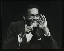 Brook Benton singing at the Forum Theatre, Hatfield, Hertfordshire, 28 October 1984. Creator: Denis Williams