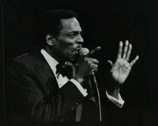 Brook Benton singing at the Forum Theatre, Hatfield, Hertfordshire, 28 October 1984. Creator: Denis Williams