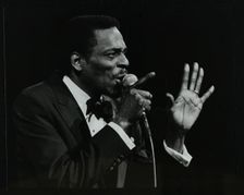 Brook Benton singing at the Forum Theatre, Hatfield, Hertfordshire, 28 October 1984. Creator: Denis Williams