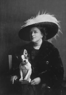 Brooks, Anita, Miss, with dog, portrait photograph, 1917 or 1918. Creator: Arnold Genthe