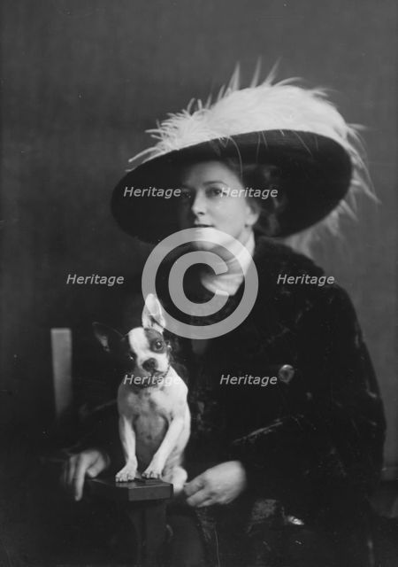 Brooks, Anita, Miss, with dog, portrait photograph, 1917 or 1918. Creator: Arnold Genthe.