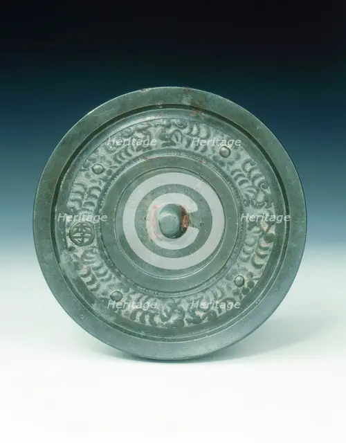 Bronze mirror with multi-armed Avalokitesvara and characters, Yuan dynasty, China, 1271-1368. Creator: Unknown.