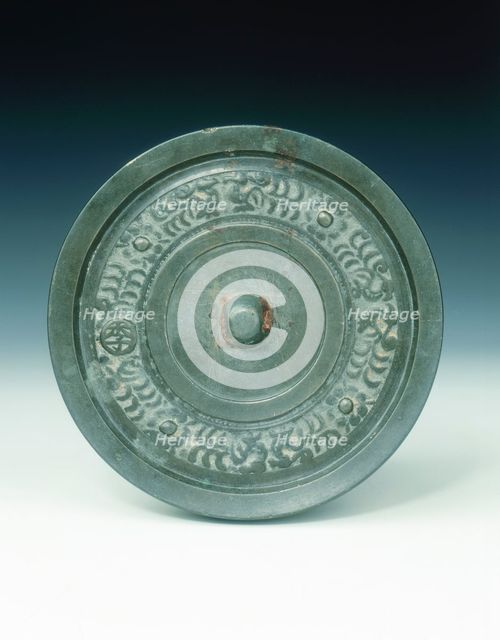 Bronze mirror with multi-armed Avalokitesvara and characters, Yuan dynasty, China, 1271-1368. Artist: Unknown