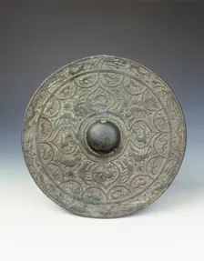 Bronze mirror with dragon and phoenix design, early Six Dynasties period, China, mid 3rd century. Creator: Unknown