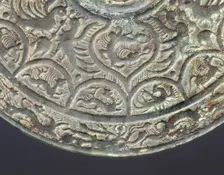 Bronze mirror with dragon and phoenix design, early Six Dynasties period, China, mid 3rd century. Creator: Unknown