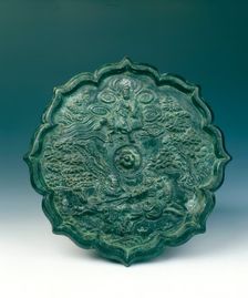 Bronze mirror showing two fighting horsemen, China, 1180-1279. Creator: Unknown