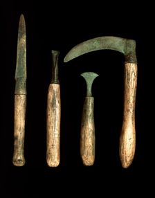 Bronze Age tools, with modern handles. Creator: Unknown