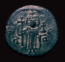 Bronze fals showing a figure holding a cross, 7th century