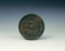 Bronze lion and grapevine mirror, Tang dynasty, China, 618-907 AD. Creator: Unknown