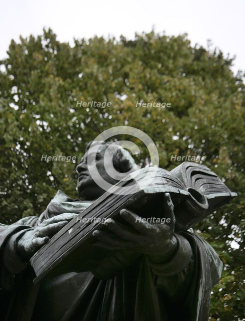 Bronze statue of Martin Luther next to the Marienkirche, (St Mary's Church), Berlin, Germany, 2025.  Creator: LTL.