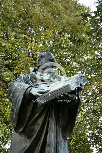 Bronze statue of Martin Luther next to the Marienkirche, (St Mary's Church), Berlin, Germany, 2025.  Creator: LTL.