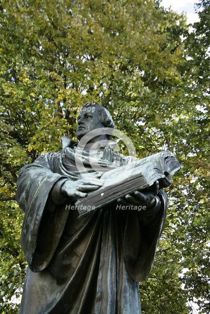 Bronze statue of Martin Luther next to the Marienkirche, (St Mary's Church), Berlin, Germany, 2025.  Creator: LTL.