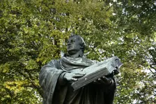 Bronze statue of Martin Luther next to the Marienkirche, (St Mary's Church), Berlin, Germany, 2025. Creator: LTL