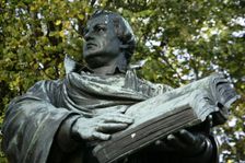 Bronze statue of Martin Luther next to the Marienkirche, (St Mary's Church), Berlin, Germany, 2025. Creator: LTL