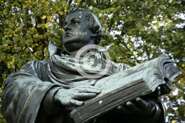 Bronze statue of Martin Luther next to the Marienkirche, (St Mary's Church), Berlin, Germany, 2025.  Creator: LTL.