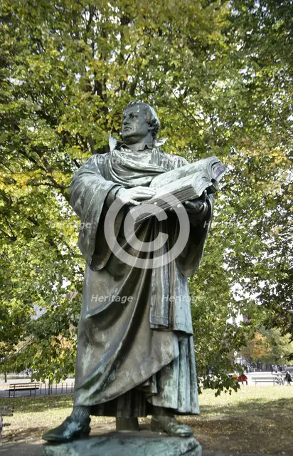 Bronze statue of Martin Luther next to the Marienkirche, (St Mary's Church), Berlin, Germany, 2025.  Creator: LTL.