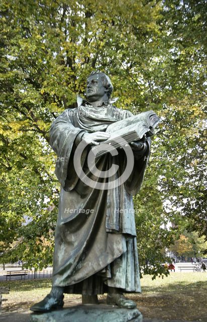 Bronze statue of Martin Luther next to the Marienkirche, (St Mary's Church), Berlin, Germany, 2025.  Creator: LTL.