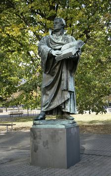 Bronze statue of Martin Luther next to the Marienkirche, (St Mary's Church), Berlin, Germany, 2025. Creator: LTL