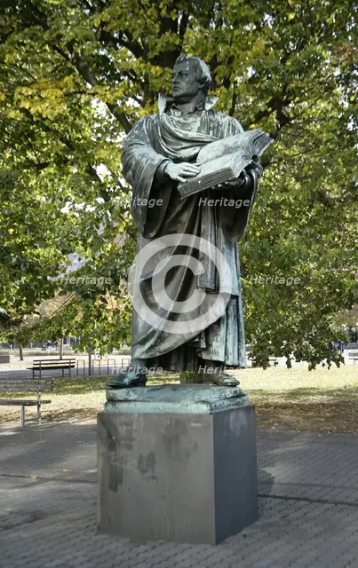 Bronze statue of Martin Luther next to the Marienkirche, (St Mary's Church), Berlin, Germany, 2025.  Creator: LTL.