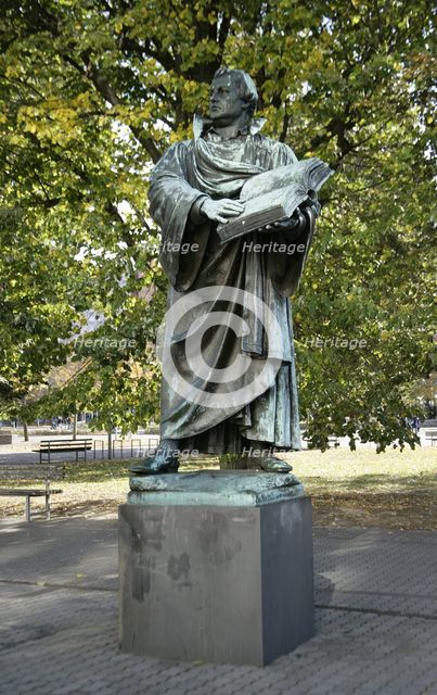 Bronze statue of Martin Luther next to the Marienkirche, (St Mary's Church), Berlin, Germany, 2025.  Creator: LTL.