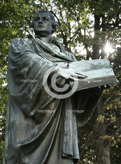 Bronze statue of Martin Luther next to the Marienkirche, (St Mary's Church), Berlin, Germany, 2025. Creator: LTL.