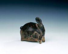 Brown glazed rabbit-shaped stoneware lime pot, Cambodia, 12th-14th century