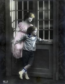 Brother and sister by a window, Sweden, c1900
