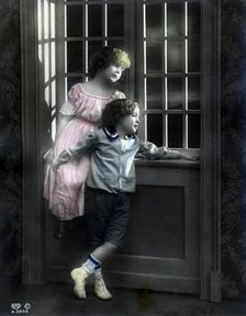 Brother and sister by a window, Sweden, c1900. Creator: Unknown