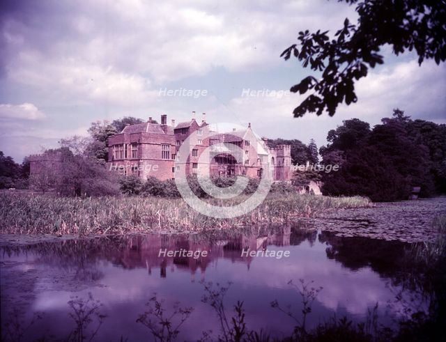 Broughton Castle and moat, Oxfordshire, c1955. [gateway, church] Creator: Arthur Charles Kirby Ware.