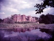 Broughton Castle and moat, Oxfordshire, c1955. [gateway, church] Creator: Arthur Charles Kirby Ware