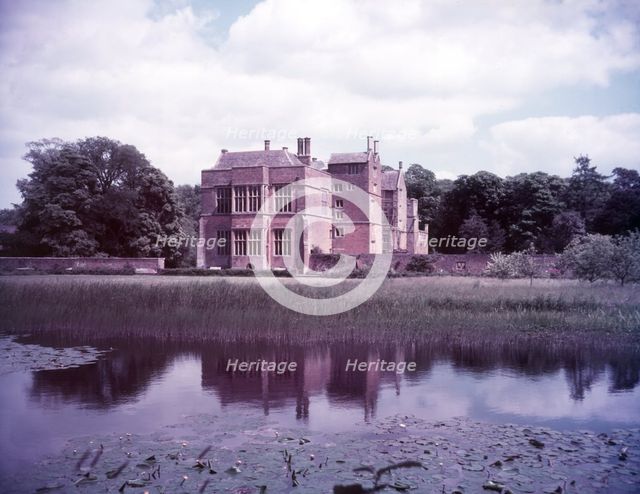 Broughton Castle and moat, Oxfordshire, c1955. [gateway, church] Creator: Arthur Charles Kirby Ware.