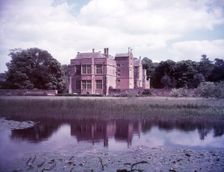 Broughton Castle and moat, Oxfordshire, c1955. [gateway, church] Creator: Arthur Charles Kirby Ware