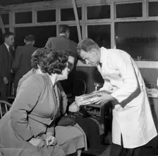 Butcher from Danish Bacon giving a demonstration, Kilnhurst, South Yorkshire, 1961. Creator: Michael Walters