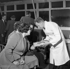 Butcher from Danish Bacon giving a demonstration, Kilnhurst, South Yorkshire, 1961. Creator: Michael Walters
