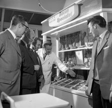 Butcher from Danish Bacon giving a demonstration, Kilnhurst, South Yorkshire, 1961. Creator: Michael Walters