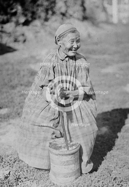 Butter churning, 1890. Creator: Unknown.