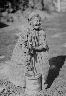 Butter churning, 1890. Creator: Unknown