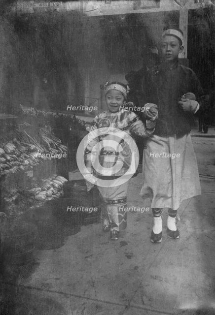 Buying New Year's gifts, Chinatown, San Francisco, between 1896 and 1906. Creator: Arnold Genthe.