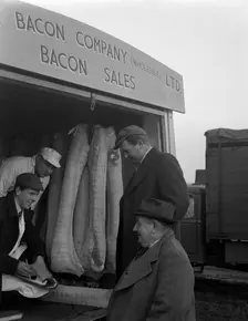 Buying wholesale meat from a Danish Bacon Company lorry, Barnsley, South Yorkshire, 1961. Creator: Michael Walters